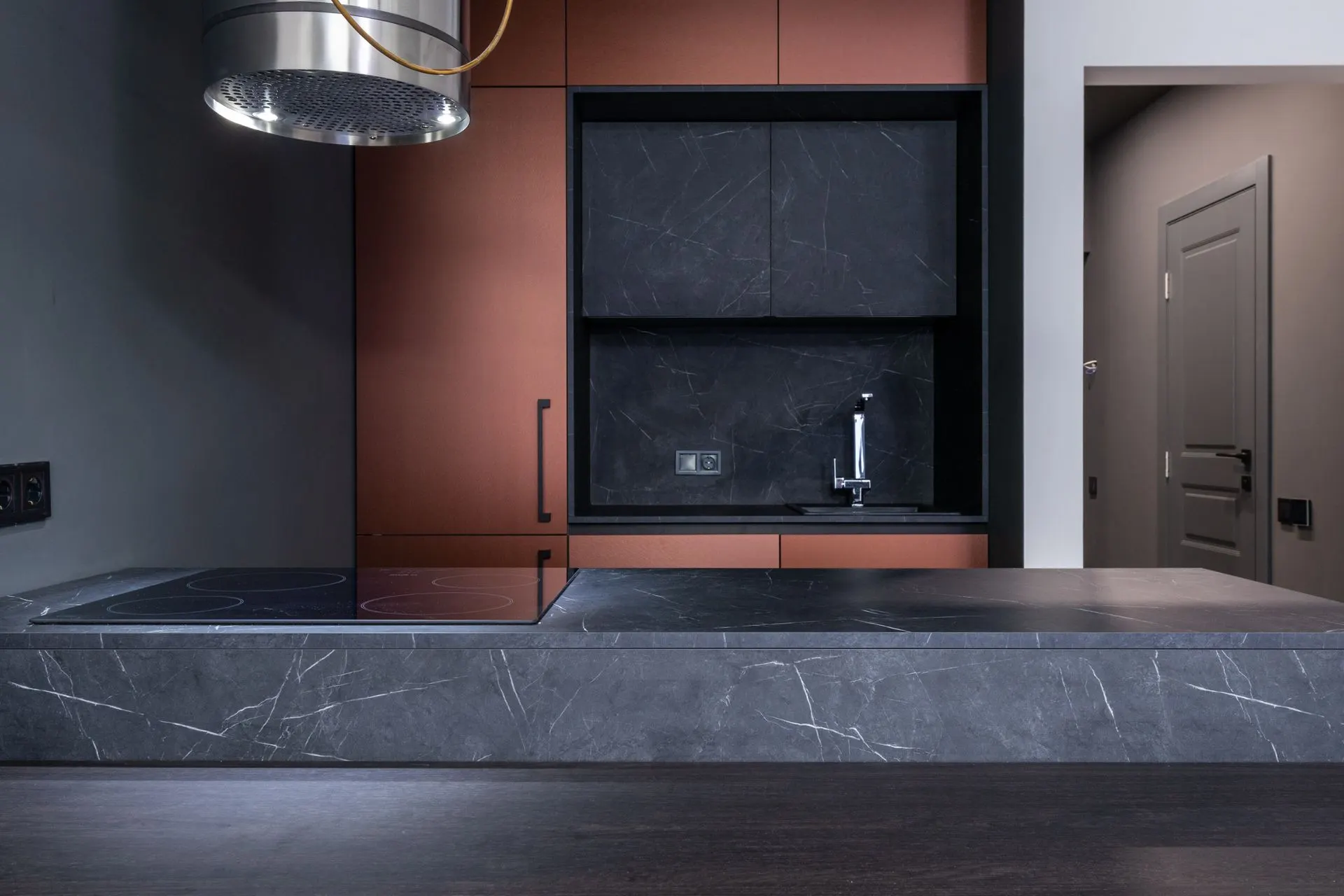 Luxury modern kitchen with marble countertops and elegant sleek design, representing an Ironstone Remodeling finished project