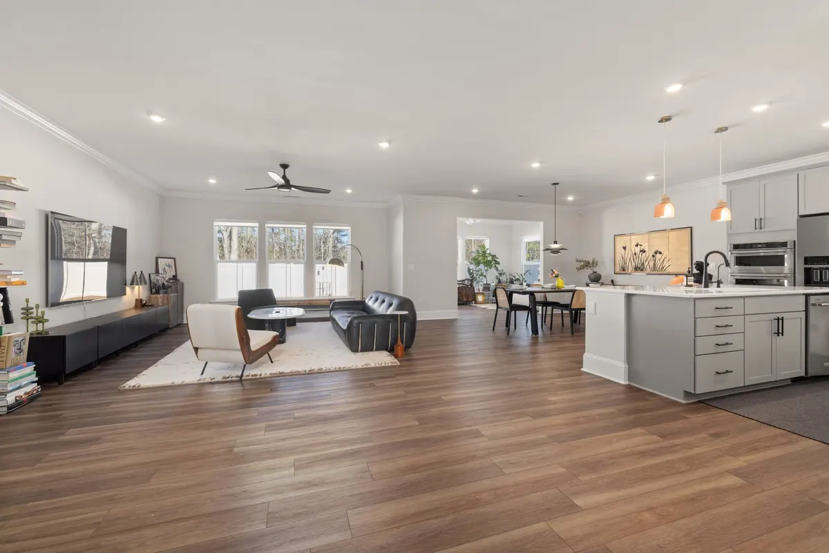 Bright open-concept living space with kitchen after a full home renovation