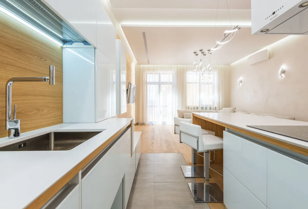 High-end modern kitchen with marble countertops and sleek cabinetry